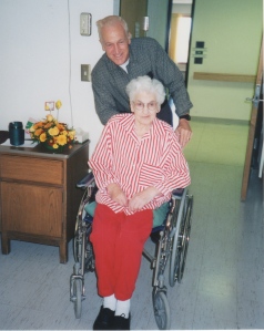 My dad with his mom when she was in a nursing home after she'd had a stroke (sometime in the 1990s).